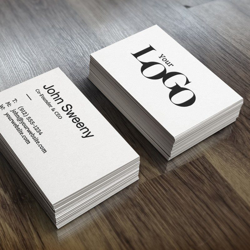 Custom printed business cards with clean, professional design and sharp colors displayed on a desk.