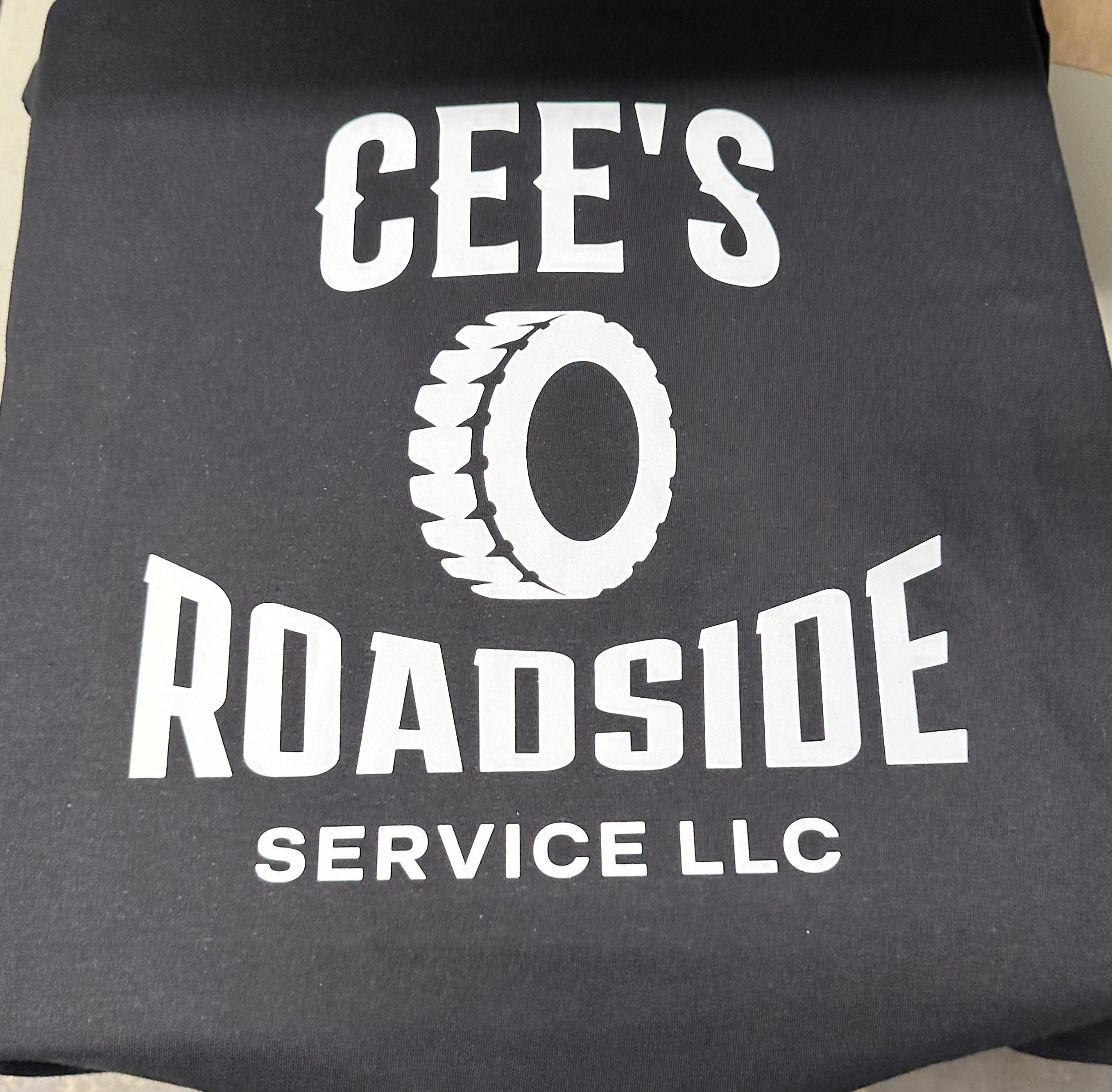 Black printed tshirt with 'CEE'S Roadside Service LLC' text and tire graphic on a gray background