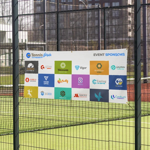 Event sponsors banner on a tennis court with a grid of colorful logos.
